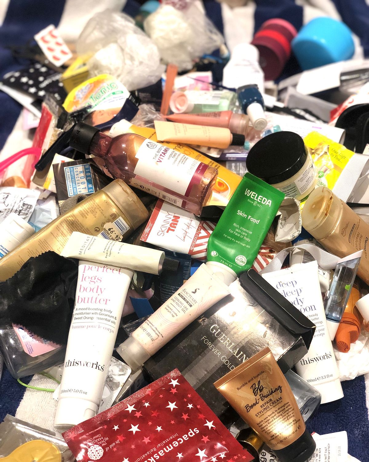 Lots of differnt cosmetics pilled up 